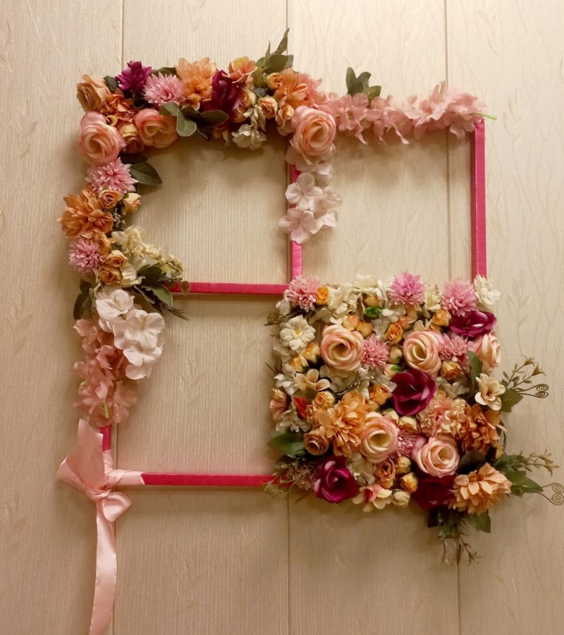 Wall hanging decoration with artificial flowers.