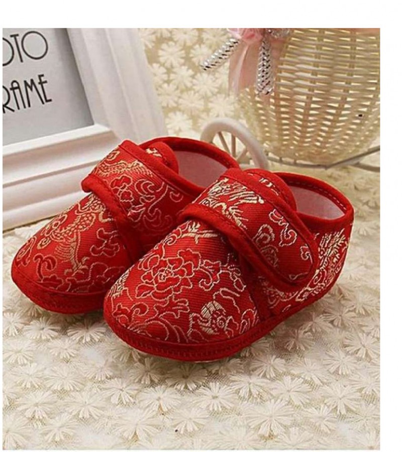 Red Pair of Canvas Shoes For Babies