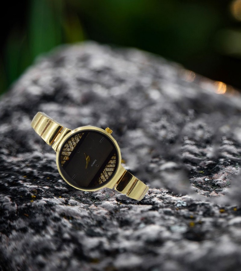 black and golden watch