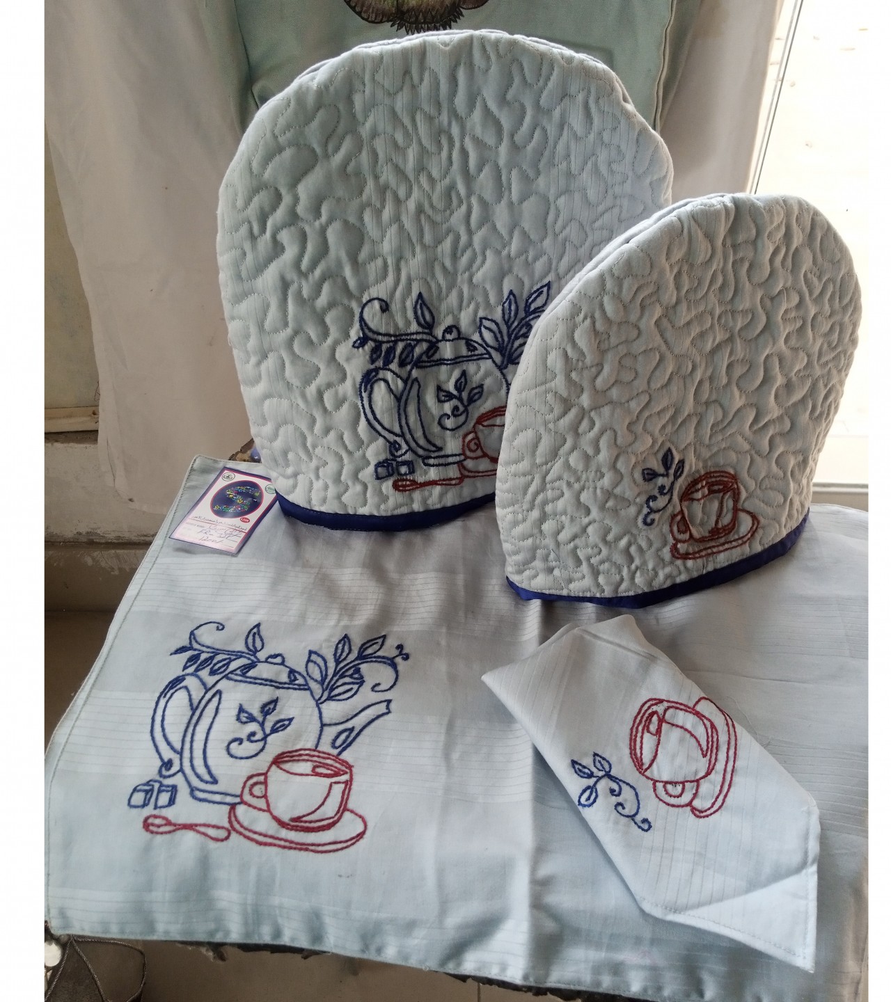 embroidered trolley runners with tikozi and mikozi